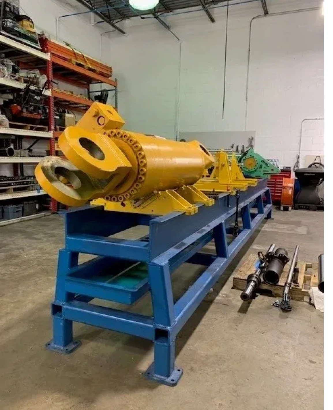 Industrial yellow machinery on blue stand